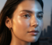 Woman with glowing hydrated skin illustrating the UAE's dual climate — desert heat and air conditioning